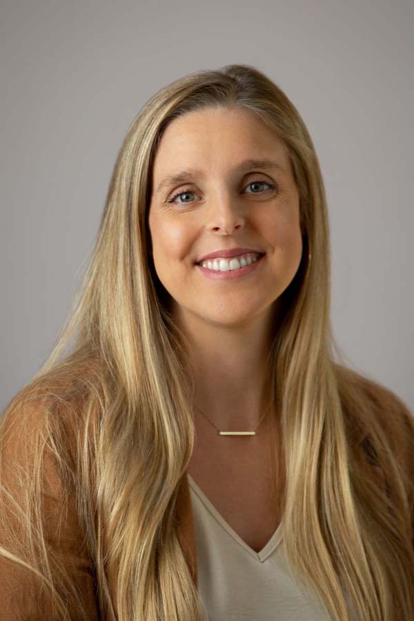 A smiling bio photo of Sarah Sweeney. 