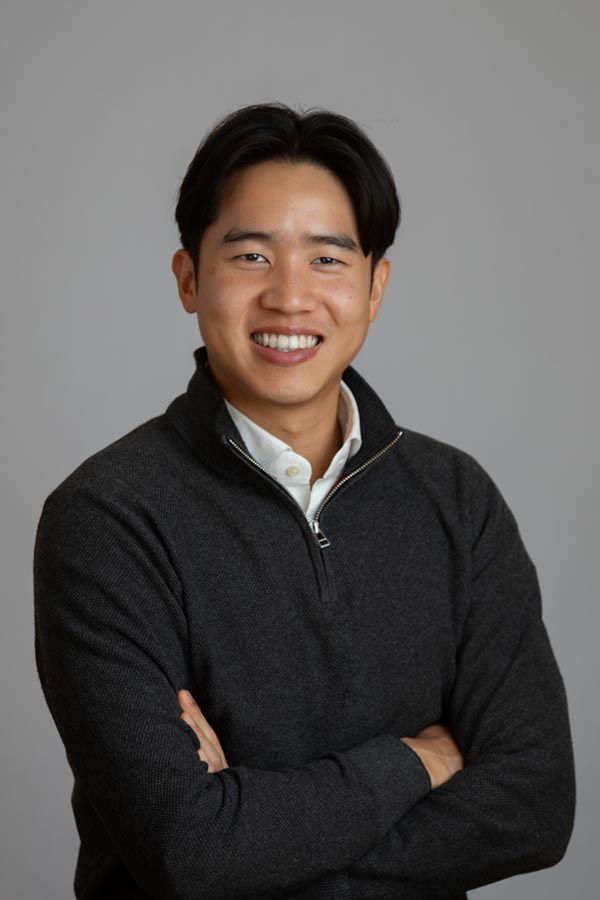 A smiling bio photo of Nicholas Tan. 